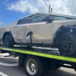 T-boned Tesla Cybertruck and a Nissan car towed from the crash site in Tampa, Florida.
