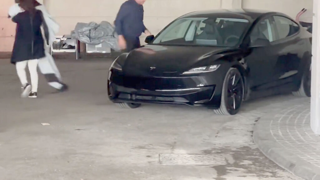 A black Tesla Model 3 Ludicrous (performance variant) spotted in Spain, Europe with the redesigned front fascia.