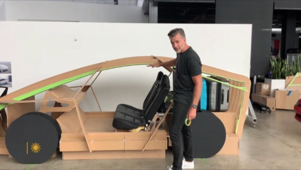 The leaked picture from inside the Tesla Design Studio in Hawthorne, California that shows the company's Chief Designer Franz von Holzhausen standing beside a concept design small Tesla car skeleton made of wood, allegedly the Tesla Robotaxi. 