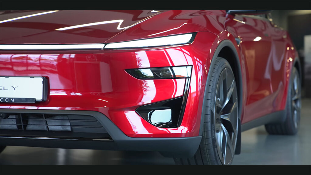 Front fascia closeup of the new Tesla Model Y Performance showing air intake under the headlight.