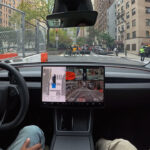 Tesla FSD v14.1.3 backing up at a red light in a construction zone to give room to pedestrians to cross the road.