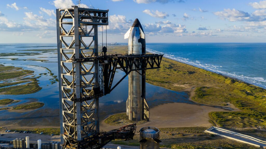 Starship 38 (Flight 11 upper stage) lifted by the launch tower Chopsticks to be integrated to the Super Heavy Booster 15-2 rocket for launch on Monday, 13th October.
