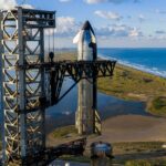 Starship 38 (Flight 11 upper stage) lifted by the launch tower Chopsticks to be integrated to the Super Heavy Booster 15-2 rocket for launch on Monday, 13th October.