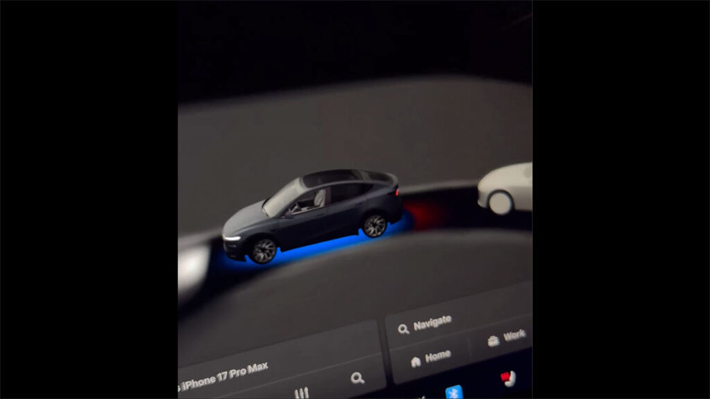 Updated driving visualizations of FSD v14 with a blue glow under the vehicle (ego) to indicate the vehicle is running on Autopilot / FSD.