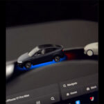 Updated driving visualizations of FSD v14 with a blue glow under the vehicle (ego) to indicate the vehicle is running on Autopilot / FSD.