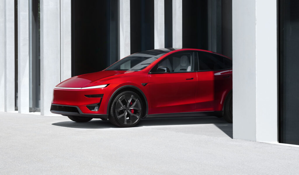 2025 Tesla Model Y Performance in Ultra Red color.