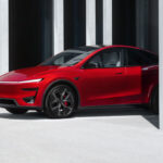 2025 Tesla Model Y Performance in Ultra Red color.