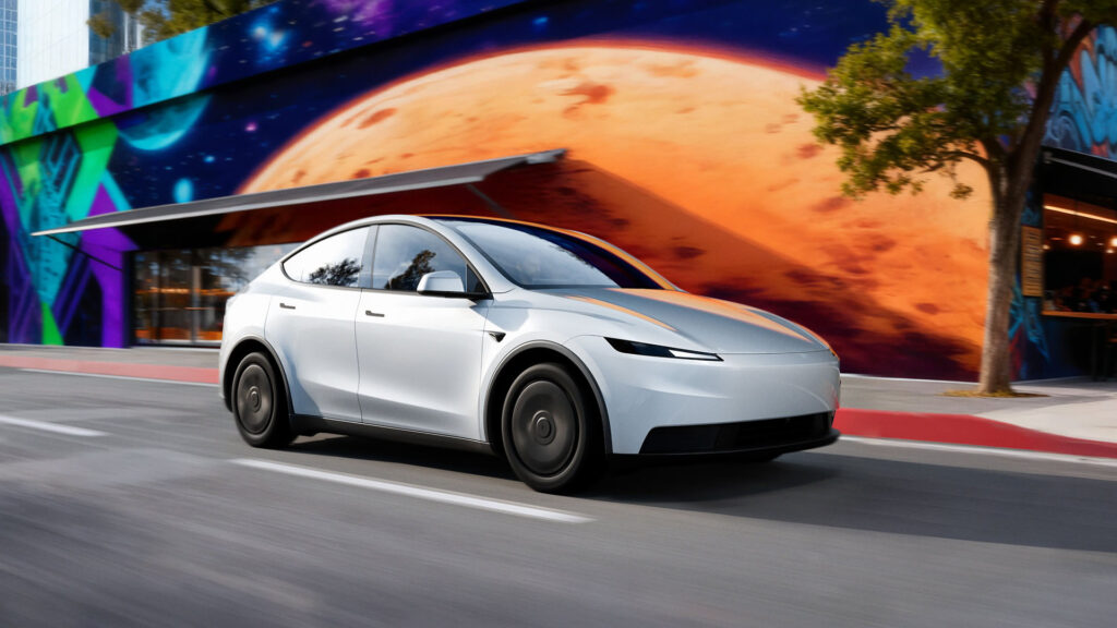Tesla Model Y Standard (Juniper) in Pearl White Multi-Coat color (side profile).