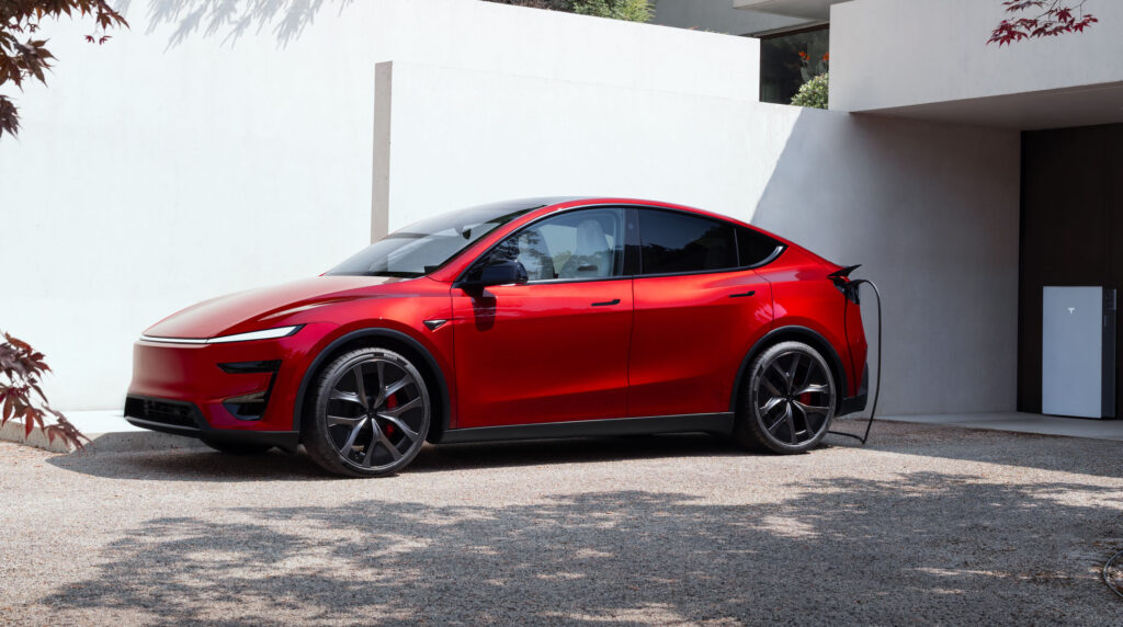 Tesla Model Y Performance in Ultra Red charging at home.