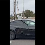 A black Tesla Robotaxi (Model Y Juniper) spotted without any human inside in Austin, Texas.
