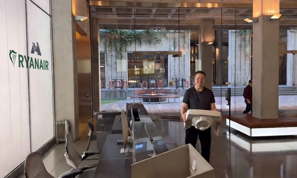 Edited picture of Elon Musk entering the Ryanair office with a porcelain bathroom sink (screenshot from Musk's video entering Twitter headquarters on October 26, 2022). Edited with Grok AI. 