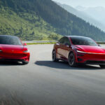 Tesla Model 3 and Model Y electric cars in Ultra Red color racing on mountainous roads.
