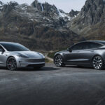 2026 Tesla Model 3 Highland (left) and the legacy Model Y electric SUV (right), parked at a scenic location.