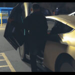 A Tesla Cybercab robotaxi prototype spotted in the wild showing its butterfly door opening and close function.