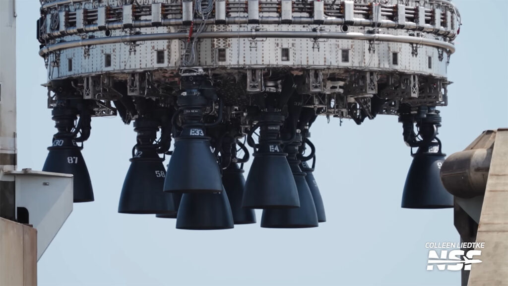 The aft section of the Flight 12 Super Heavy Booster 19 showing only ten Raptor 3 engines as it gets lifted onto the Pad 2 orbital launch mount (OLM) at Starbase, Texas.
