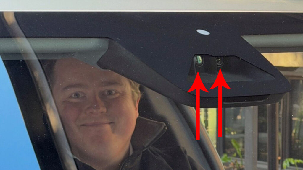 Enlarged front-facing Autopilot cameras in the Tesla Cybercab robotaxi vehicle.