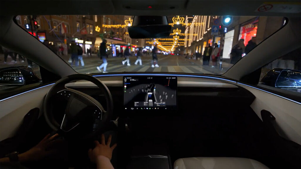Tesla FSD getting tested in Europe in a crowded pedestrian scenario at a zebra crossing/crosswalk.