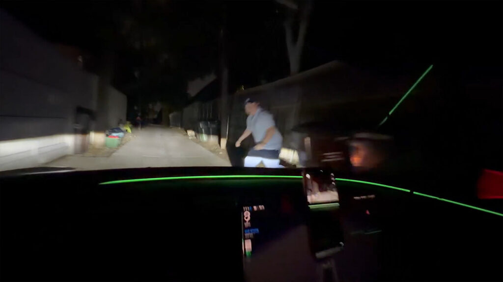 Tesla owner and his friend test the improved reaction time of FSD v14.3 by jumping in front of the vehicle from a dark spot on the side of the road.