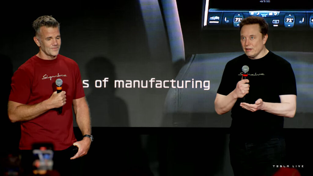 Tesla's Chief Designer Franz von Holzhausen (left) and CEO Elon Musk (right) on stage during the Signature Edition Model S and X Delivery Event at the Fremont factory.