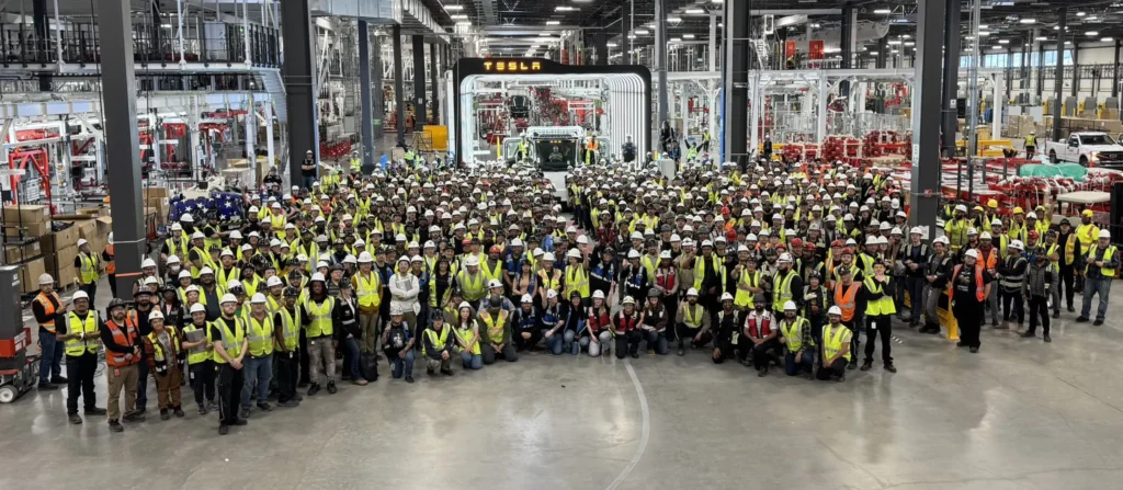 Giga Nevada employees celebrating the production of the first Tesla Semi rolling off the production line.