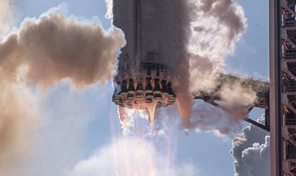 The aft section of the Flight 12 Starship Super Heavy Booster 19 rocket, as 33 Raptor engines lift off the largest space vehicle ever made.