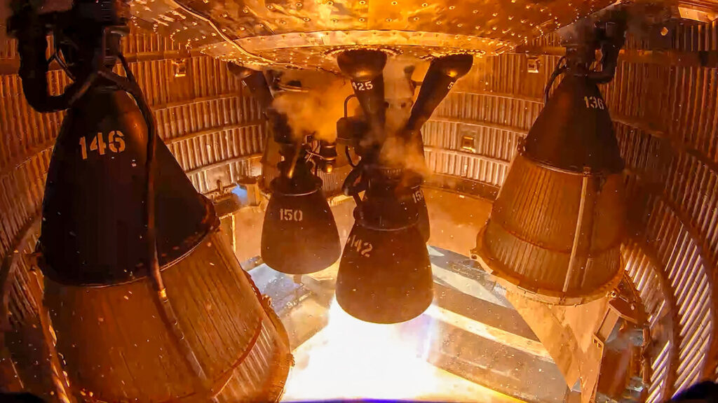 A single Raptor 3 engine firing under Starship 40 (Flight 13 upper stage) on a static fire test stand at the Masseys Outpost, Starbase, Texas.