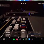Tesla FSD v14.3.3 driving visualizations in heavy traffic as the vehicles approach a red light.