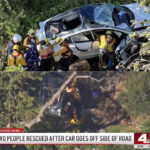 The fallen Tesla Model 3 as firefighters rescue the couple from a cliff depth of 300 feet on the side of the Mulholland Highway in Malibu, California.
