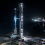 Fully stacked Flight 13 Starship at the Starbase launch tower (Ship 40 mounted on Super Heavy Booster 20; the booster is mounted on the Pad 2 OLM).