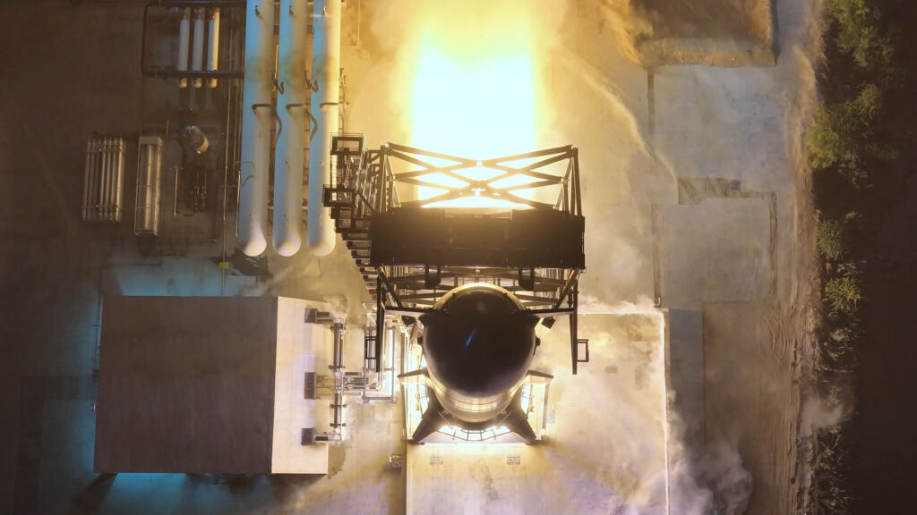 Flight 14 Starship (Ship 41) going through a 6-engine static fire test. The test stand flame trench shows a massive thrust of the six Raptor 3 engines firing at once.