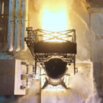 Flight 14 Starship (Ship 41) going through a 6-engine static fire test. The test stand flame trench shows a massive thrust of the six Raptor 3 engines firing at once.