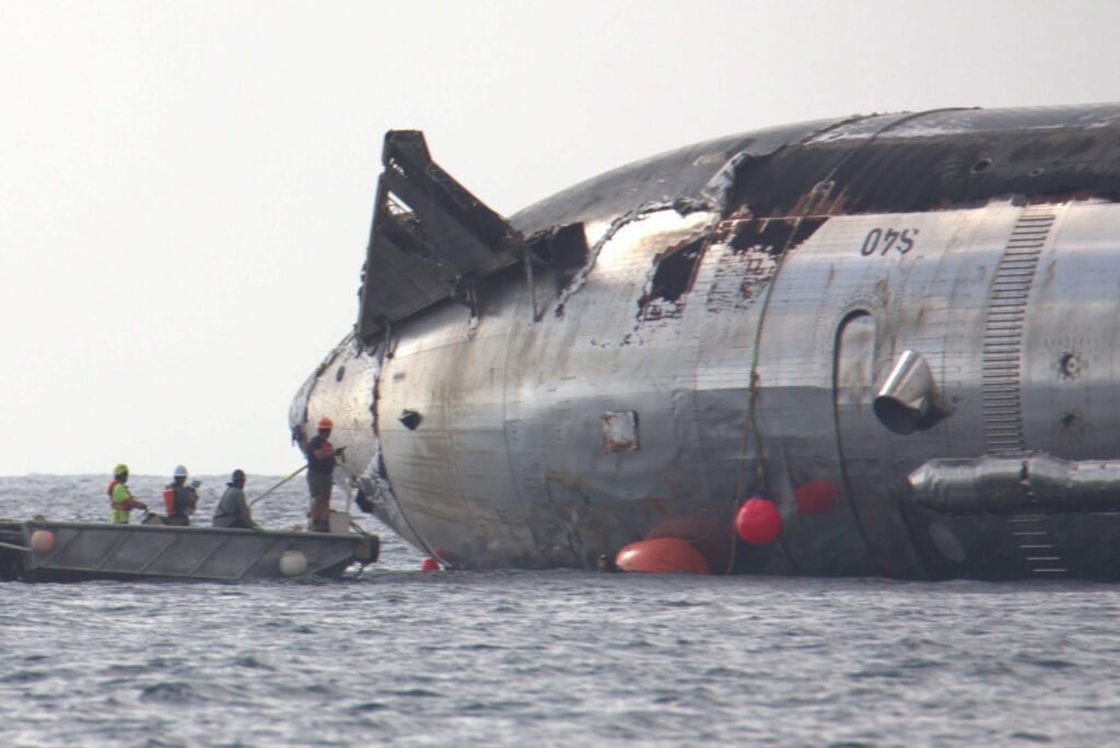 SpaceX engineers and technicians inspecting the Flight 13 Starship (Ship 40) from a boat as it still floats in the Indian Ocean (picture shared by Elon Musk on Friday, August 21, 2026).