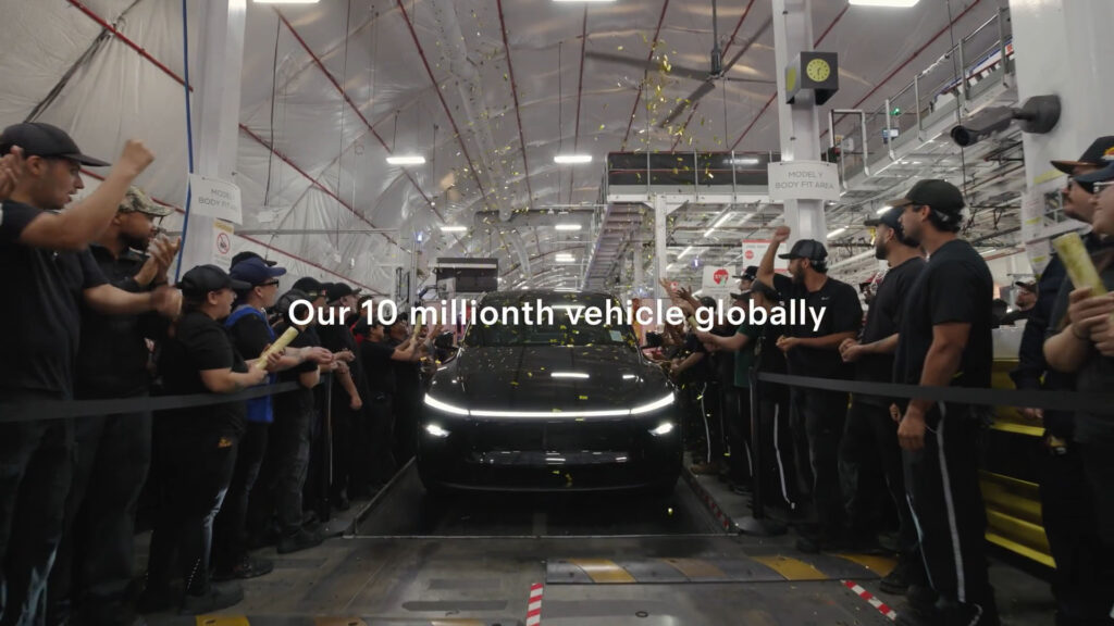 Tesla employees gather to celebrate the company's production of its 10-millionth vehicle (globally), as a Model Y Juniper comes out of the assembly at the Fremont, California factory.