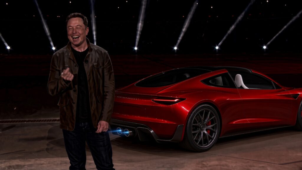 Elon Musk laughing as he presents the next-gen Tesla Roadster to the world (2017 launch picture re-imagined with Grok).