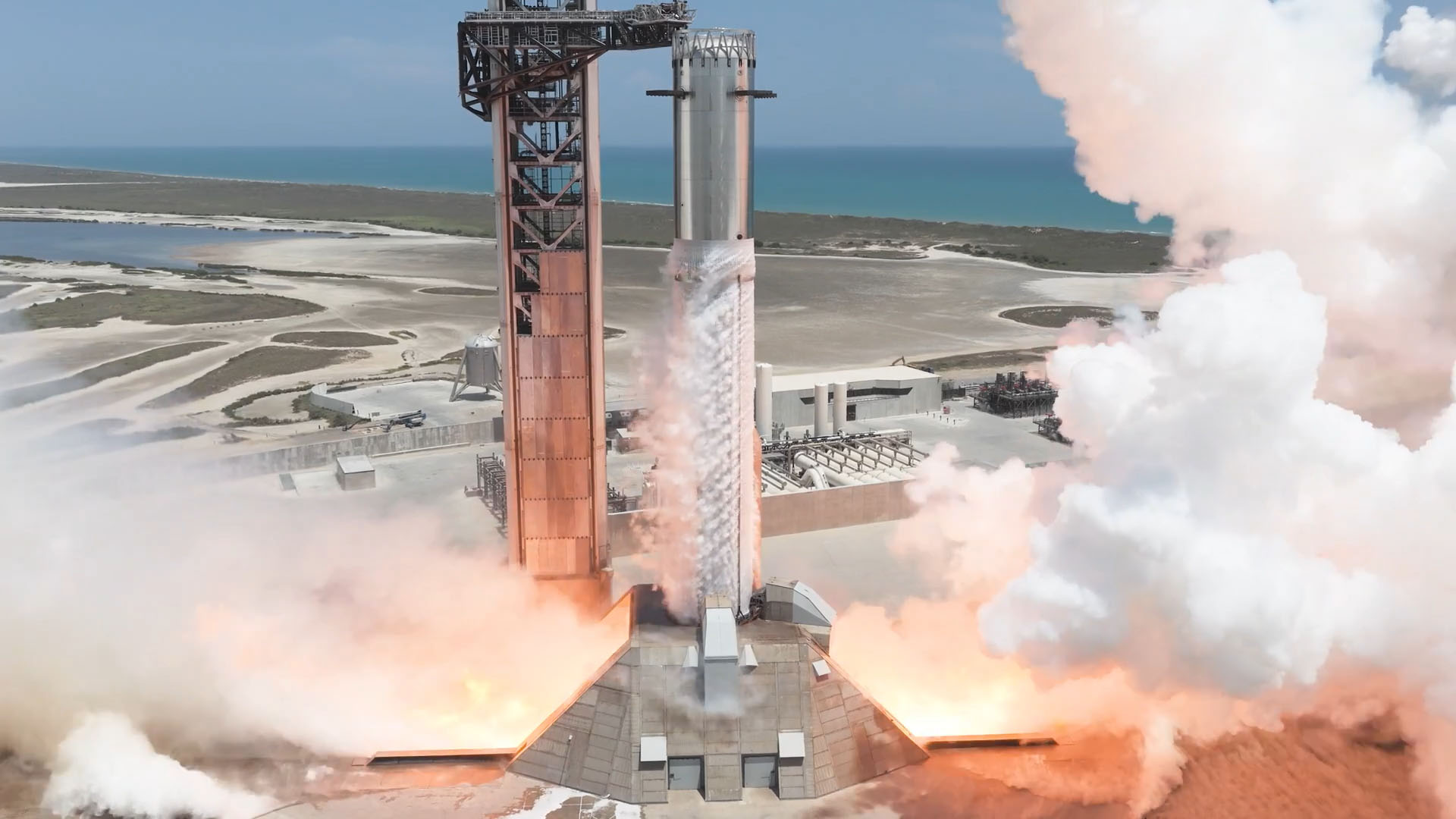 Booster 21 conducts a 33-engine static fire at Starbase's Pad 2 ahead of Starship Flight 14