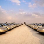 A fleet of Tesla Cybercabs outside the launch event venue in Austin, Texas (September 3, 2026).