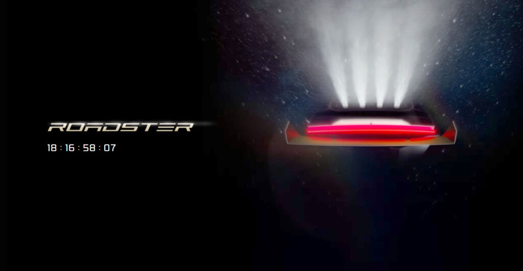 Screenshot of the official Tesla Roadster launch countdown webpage. The teaser image on the right side shows four SpaceX thrusters firing and an obscured view of the rear fascia (brightness increased to lighten shadows).