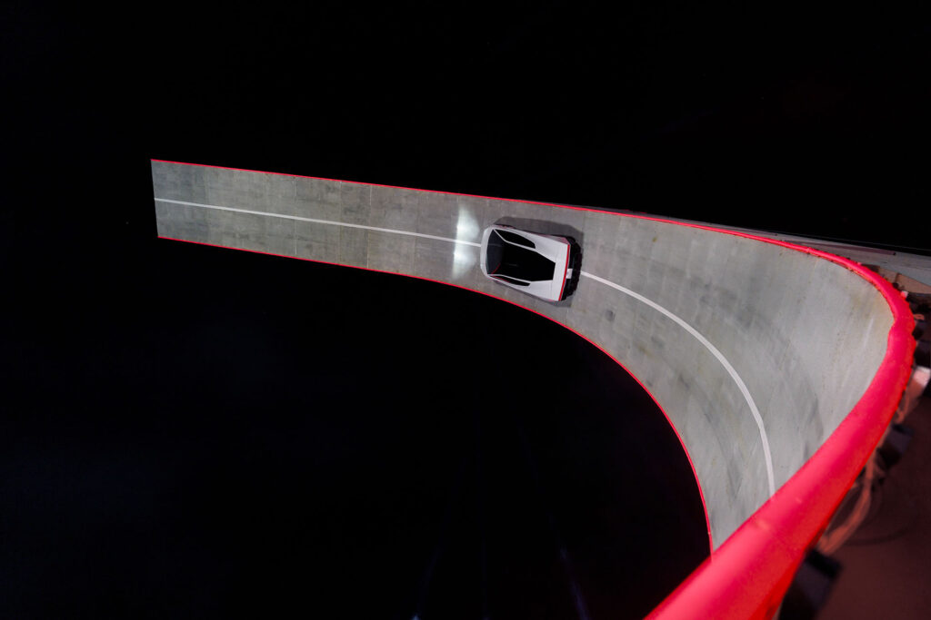 Next-gen Tesla Roadster Rocket climbing the arched ramp at the unveiling site (SpaceX McGregor, Texas).